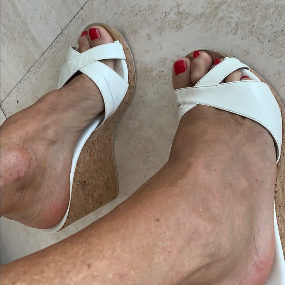 Jimmy Choo white sandal.( small un noticeable line